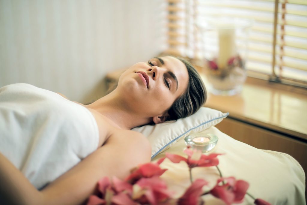 woman laying on spa table