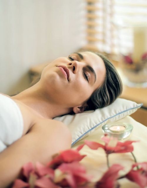 woman laying on spa table